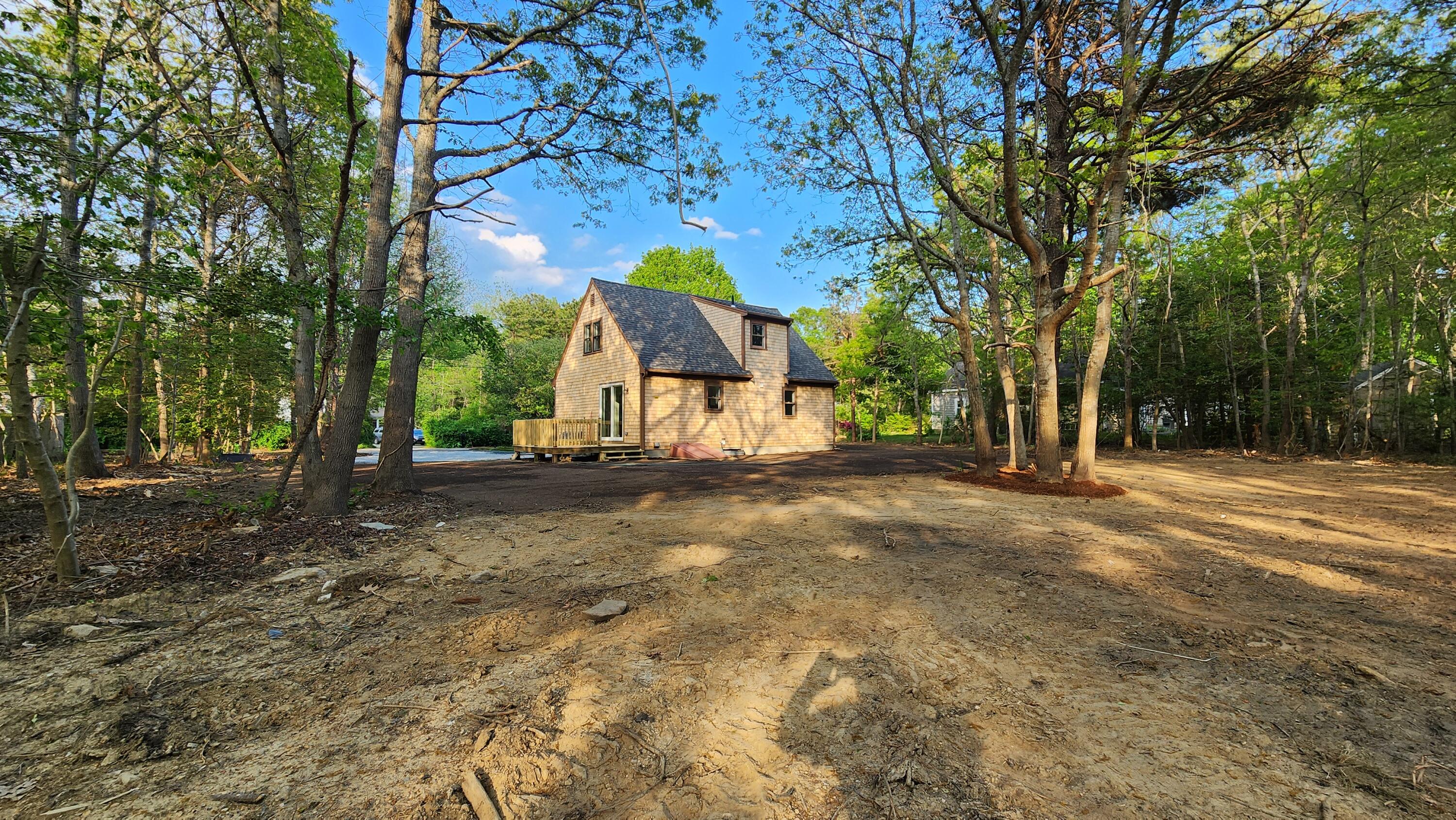 147 Chippingstone Road Marstons Mills, MA 02648 - Photo 13 of 23 a view of a tree in front of a house