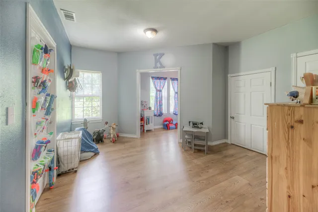 a bedroom with a bed and a cabinets