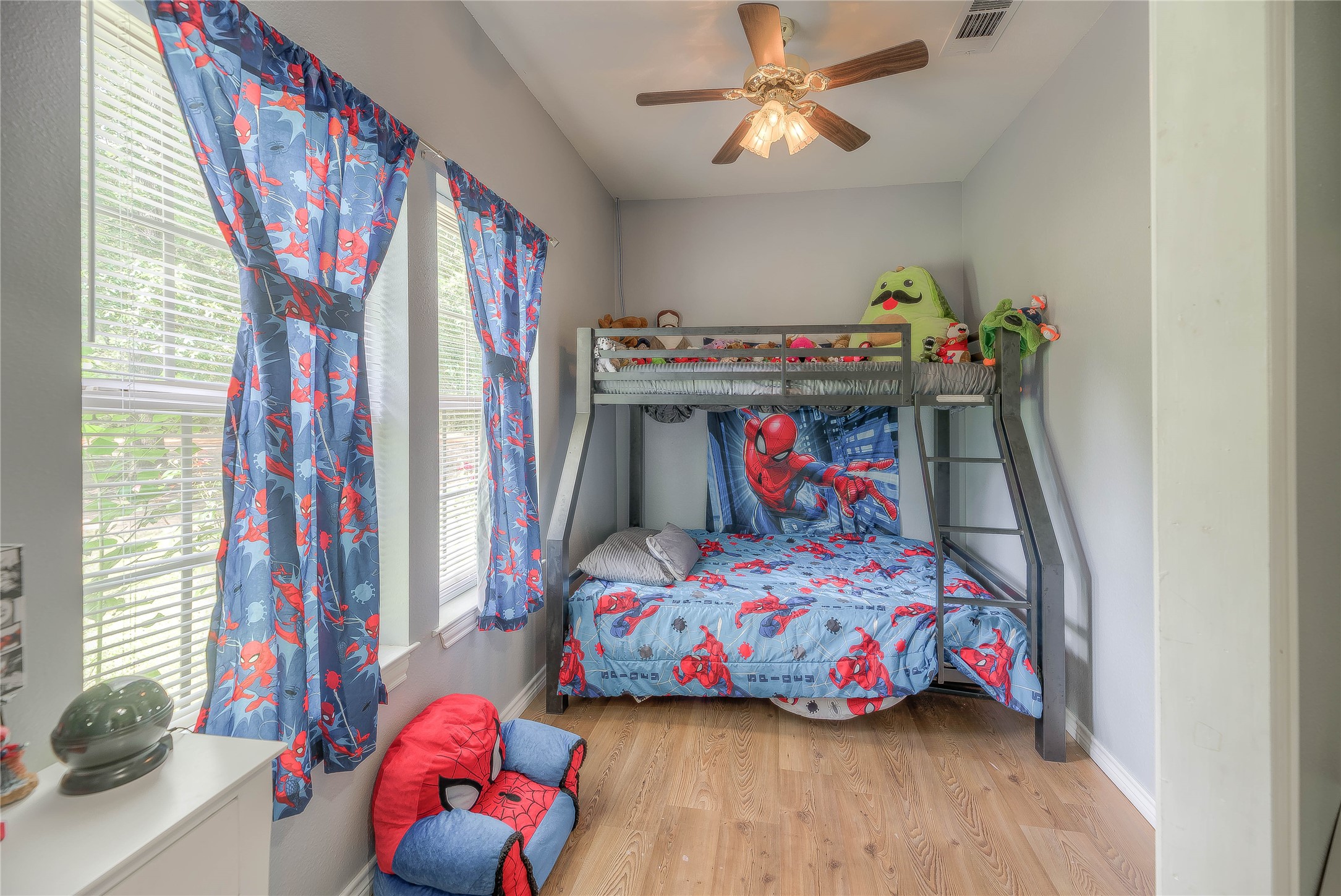 110 Happy Trails Road Coldspring, TX 77331 - Photo 15 of 49 a bedroom with a bed and a chandelier