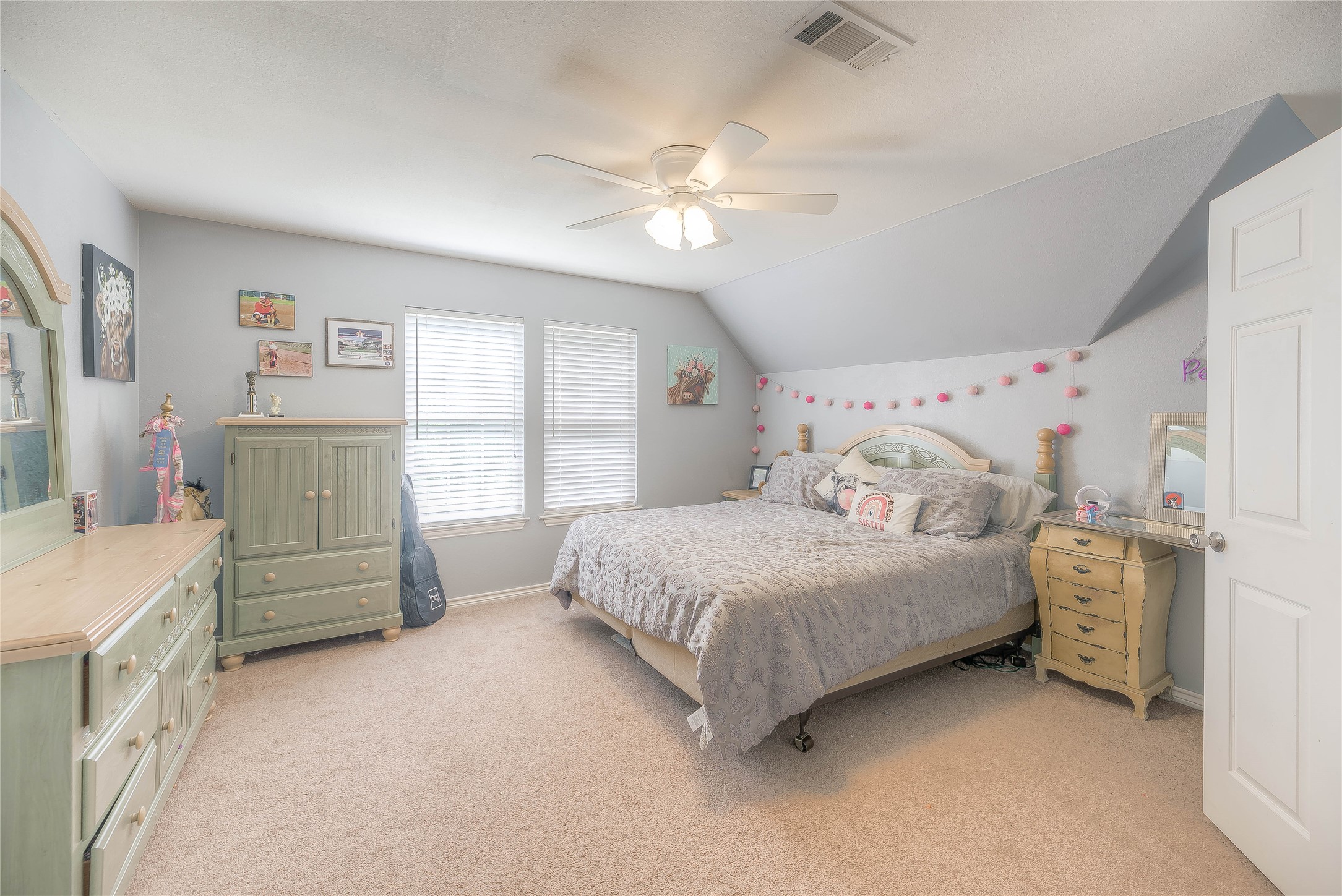 110 Happy Trails Road Coldspring, TX 77331 - Photo 17 of 49 a bedroom with a bed and a cabinets