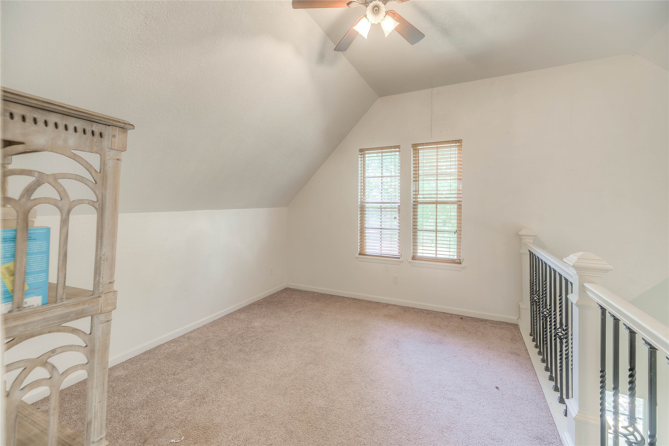 110 Happy Trails Road Coldspring, TX 77331 - Photo 27 of 49 Upstairs loft area looks down into living area in guest home.
