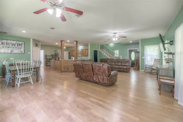 a view of a dining room with furniture and wooden floor