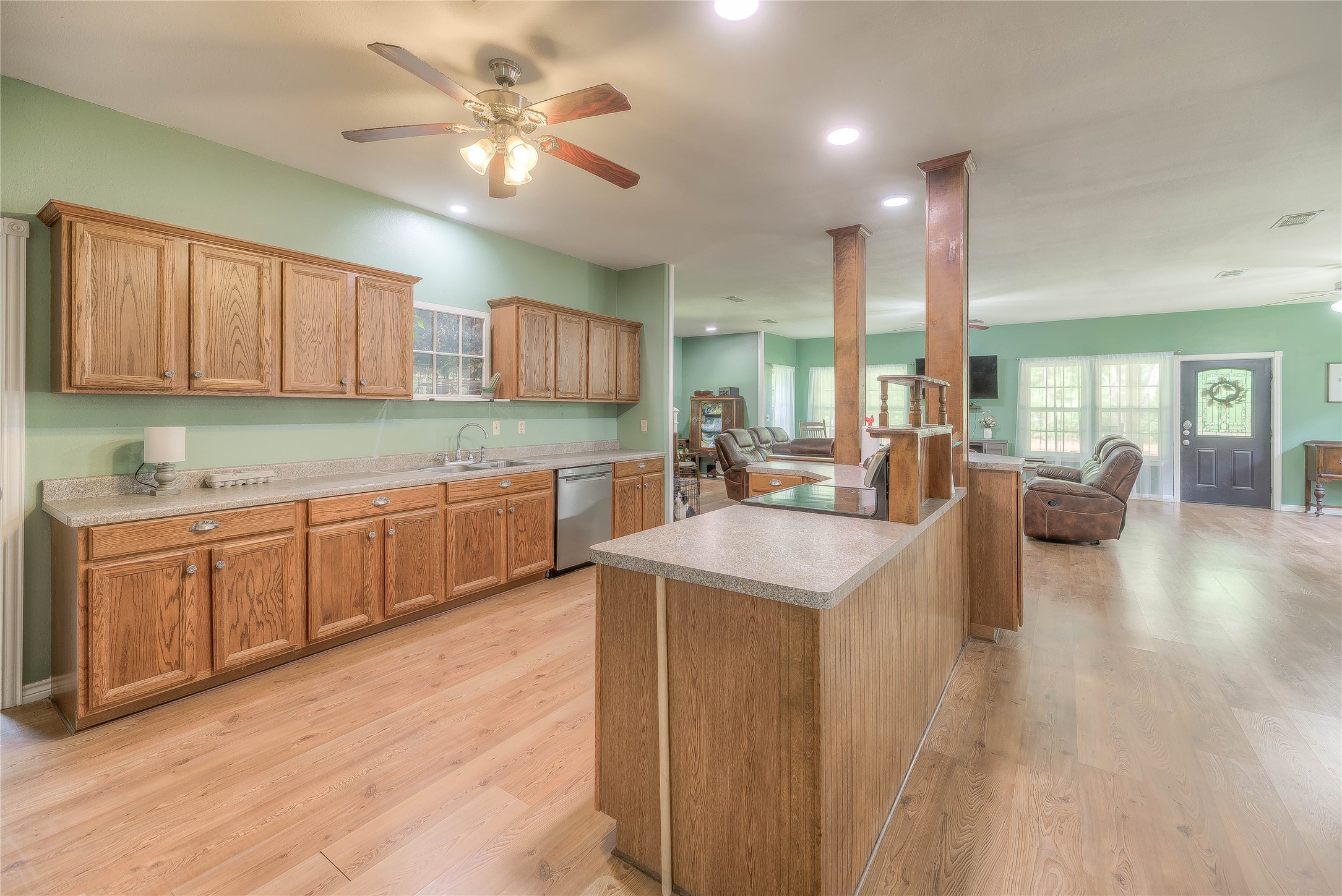 110 Happy Trails Road Coldspring, TX 77331 - Photo 9 of 49 a kitchen with sink stove and cabinets