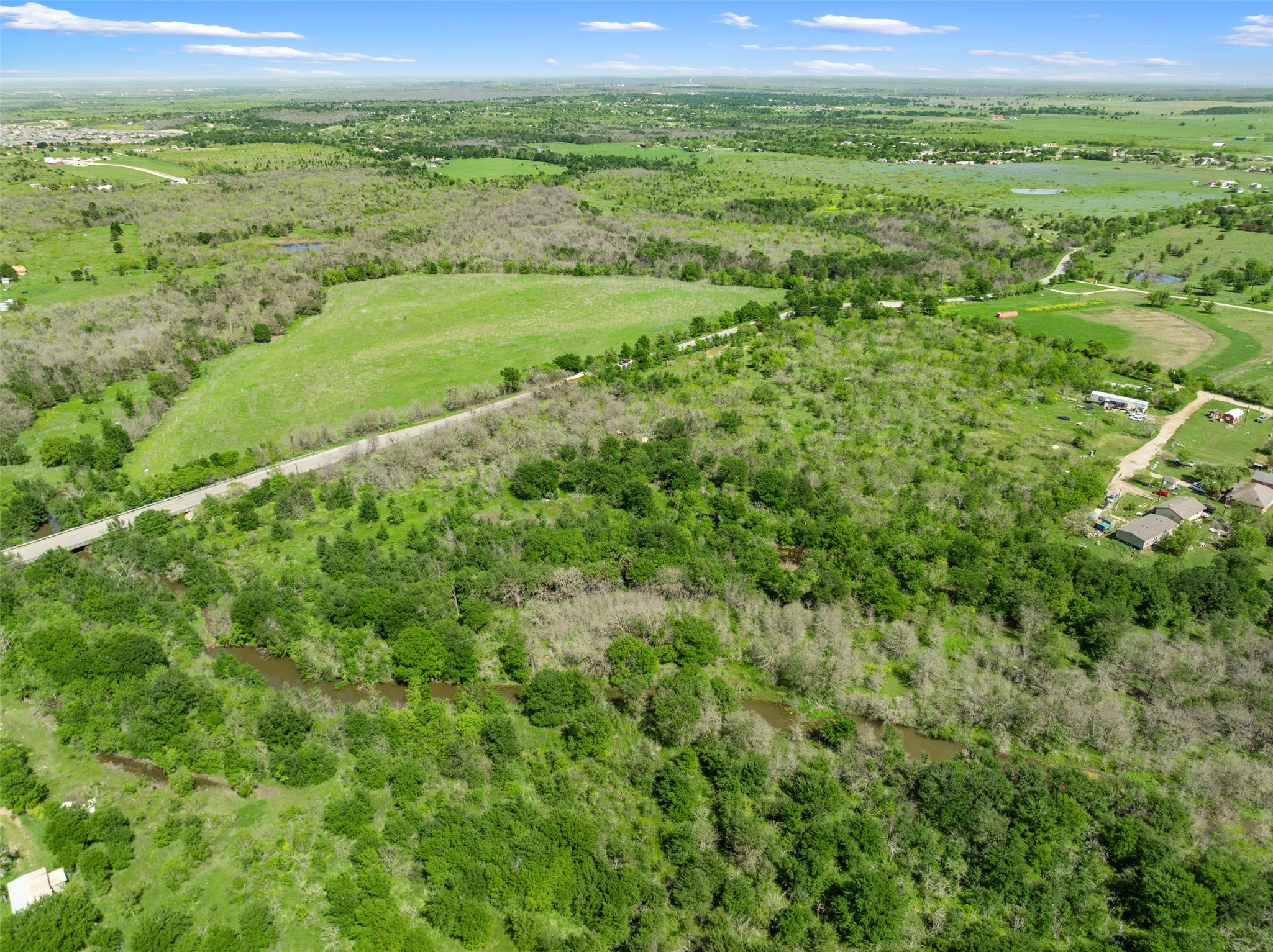 0 Jacobson Road Del Valle, TX 78617 - Photo 12 of 40 a view of a green field with lots of bushes