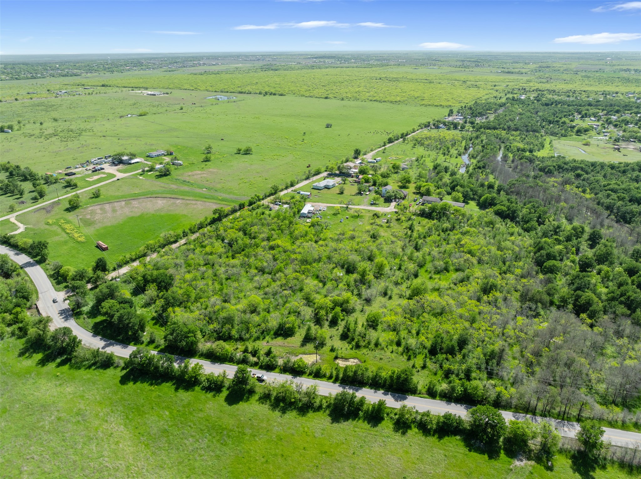 0 Jacobson Road Del Valle, TX 78617 - Photo 21 of 40 a view of a green field with lots of green space