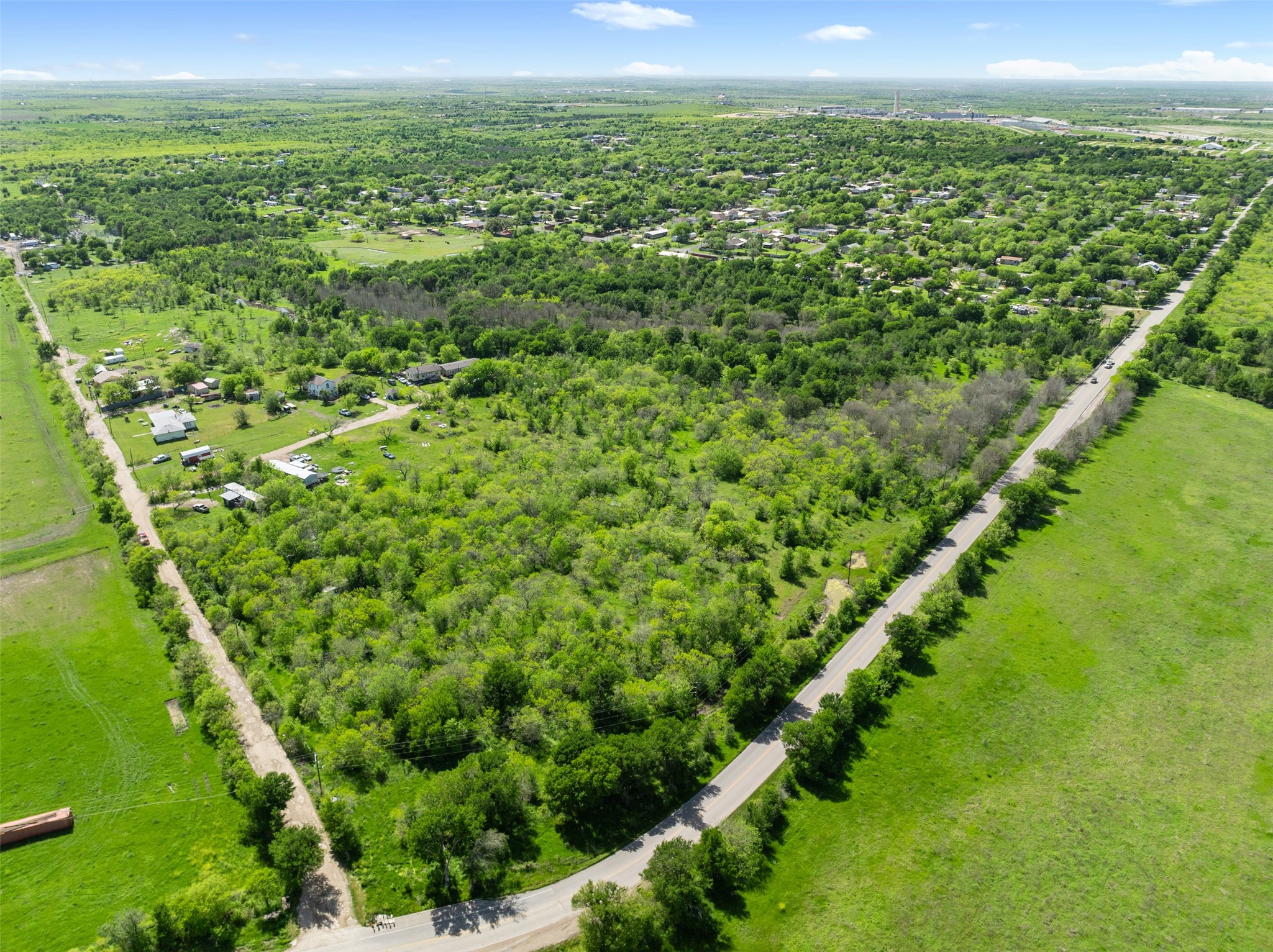 0 Jacobson Road Del Valle, TX 78617 - Photo 24 of 40 a view of a green field with lots of bushes