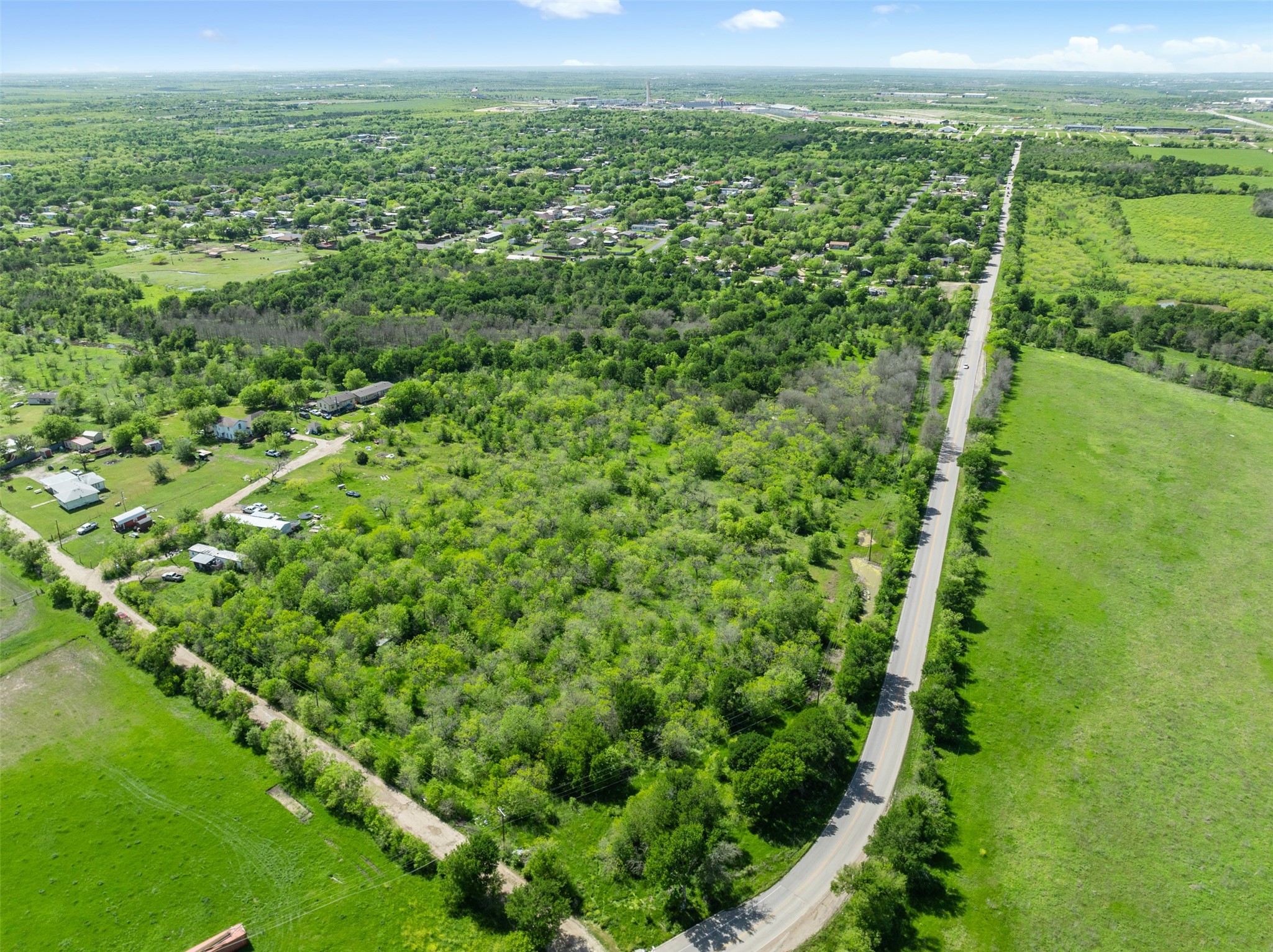 0 Jacobson Road Del Valle, TX 78617 - Photo 25 of 40 a view of a green field with lots of bushes