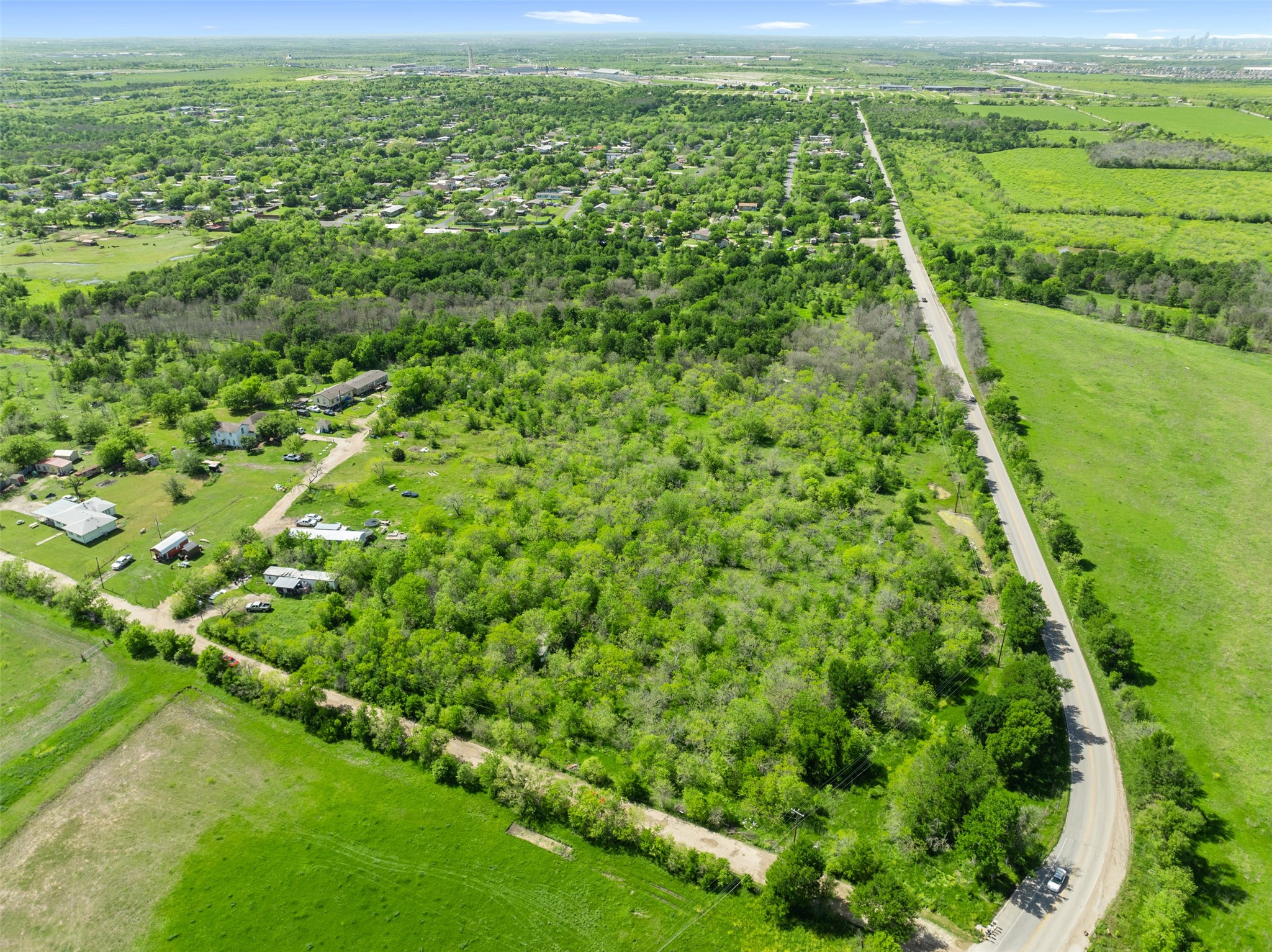 0 Jacobson Road Del Valle, TX 78617 - Photo 26 of 40 a view of a lush green forest with an outdoor seating
