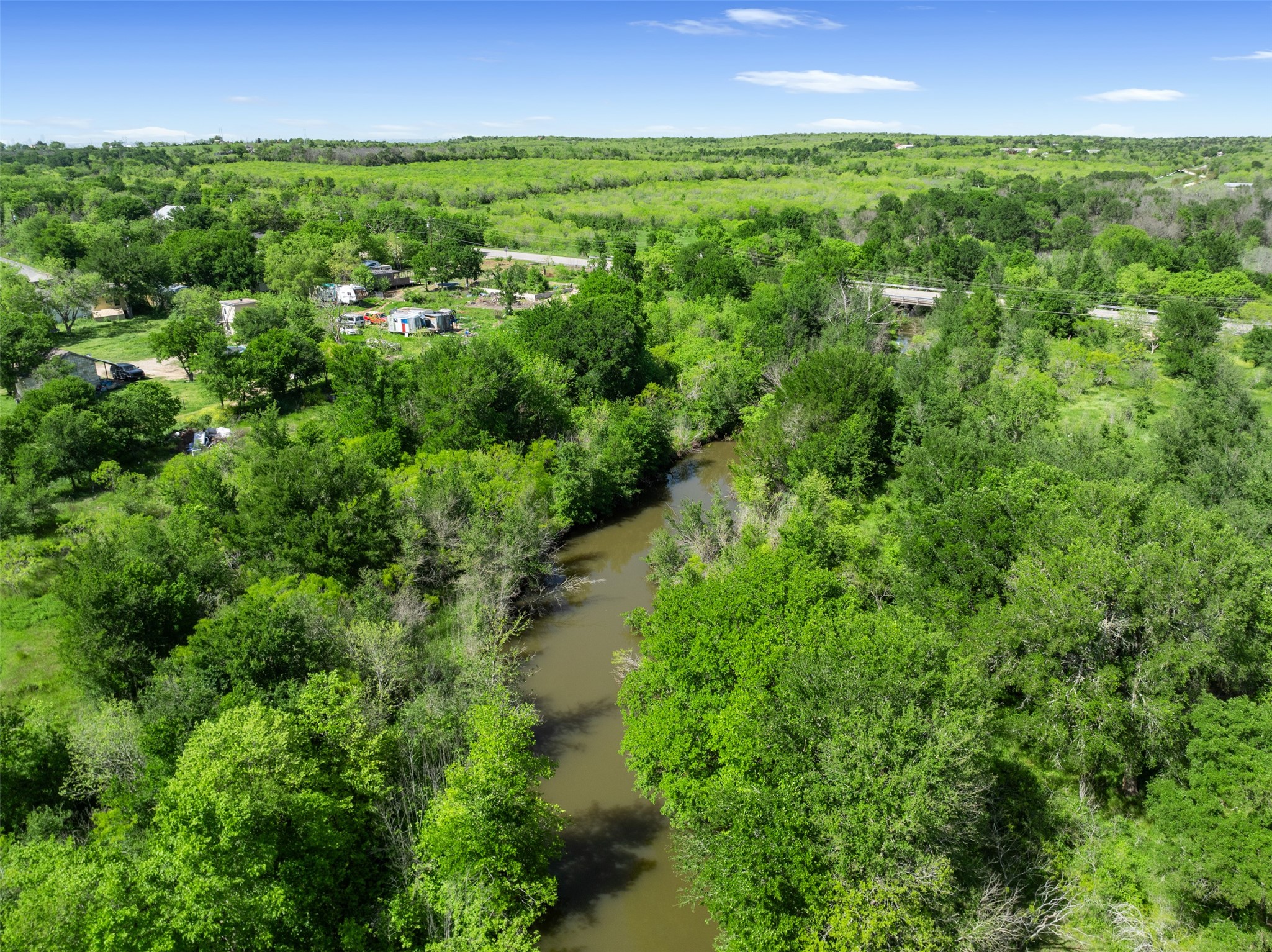 0 Jacobson Road Del Valle, TX 78617 - Photo 4 of 40 an aerial view of residential houses with outdoor and green space