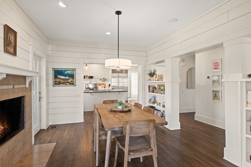 3107 Beverly Road Austin, TX 78703 - Photo 21 of 40 a dining room with furniture a floor to ceiling window and wooden floor
