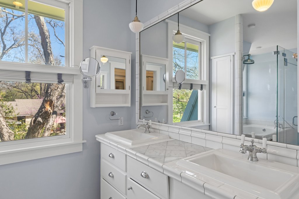 3107 Beverly Road Austin, TX 78703 - Photo 25 of 40 a bathroom with a granite countertop sink mirror and window