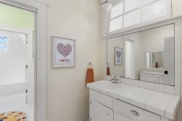 a bathroom with a sink and a mirror