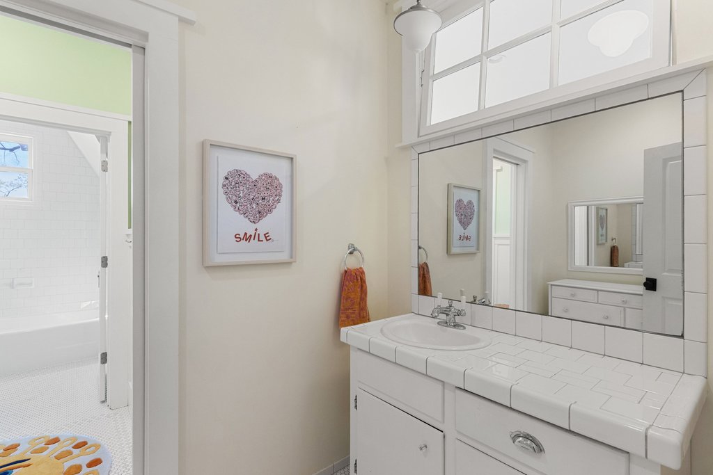 3107 Beverly Road Austin, TX 78703 - Photo 29 of 40 a bathroom with a sink and a mirror
