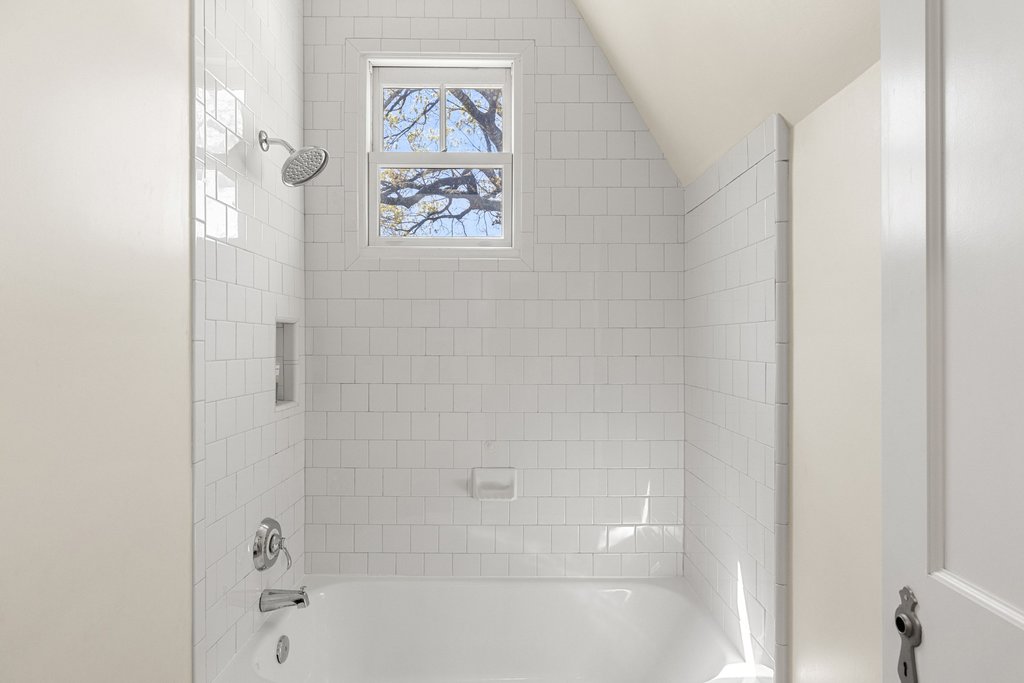 3107 Beverly Road Austin, TX 78703 - Photo 30 of 40 a bathroom with a bathtub and a shower