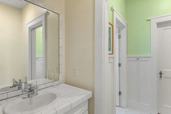 a bathroom with a sink and a mirror
