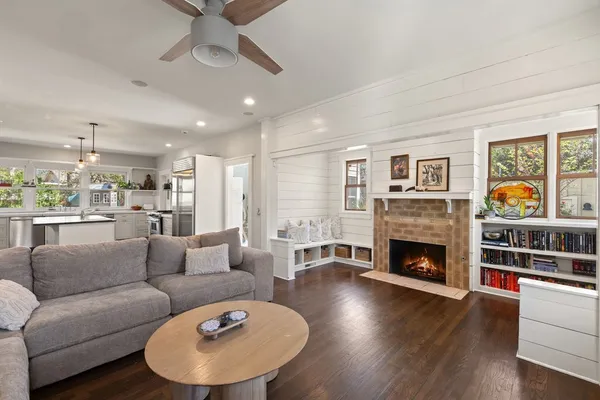 a living room with furniture and a fireplace