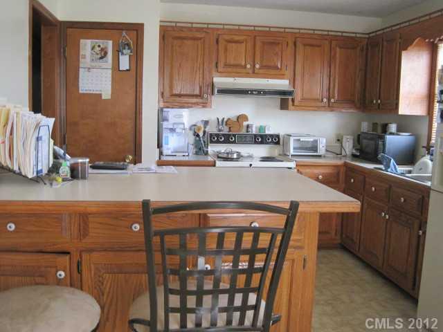 3325 Williamson Road Rock Hill, SC 29730 - Photo 16 of 16 a kitchen with stainless steel appliances granite countertop a sink a stove a refrigerator a washer and dryer