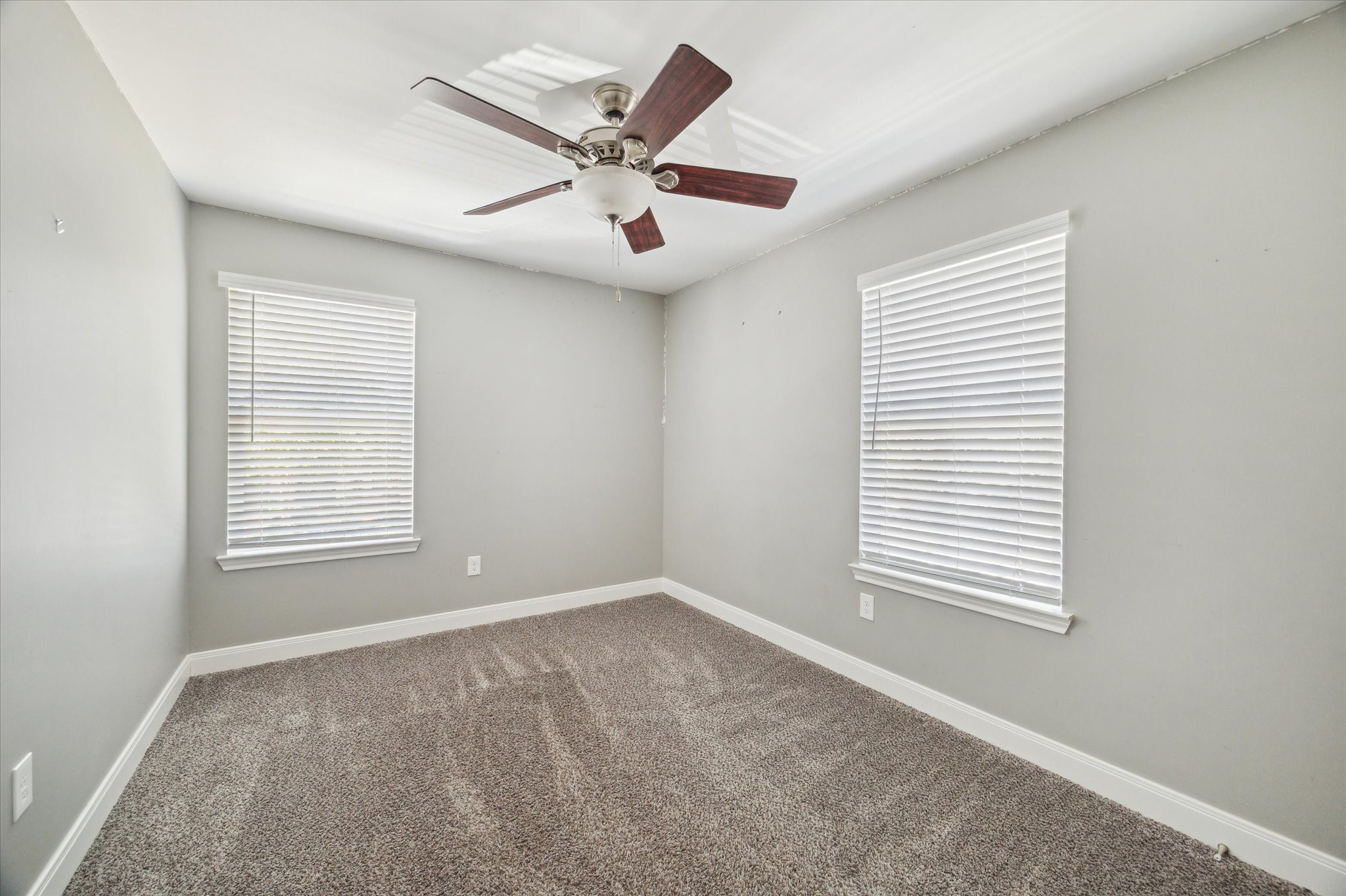 6047 Floyd Street Houston, TX 77007 - Photo 12 of 22 a view of an empty room with a window