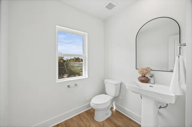 a bedroom with a large bed and a large window