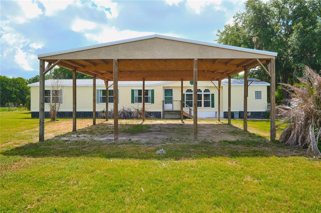2701 Murphy Road Ona, FL 33865 - Photo 31 of 41 a view of a house with backyard and porch