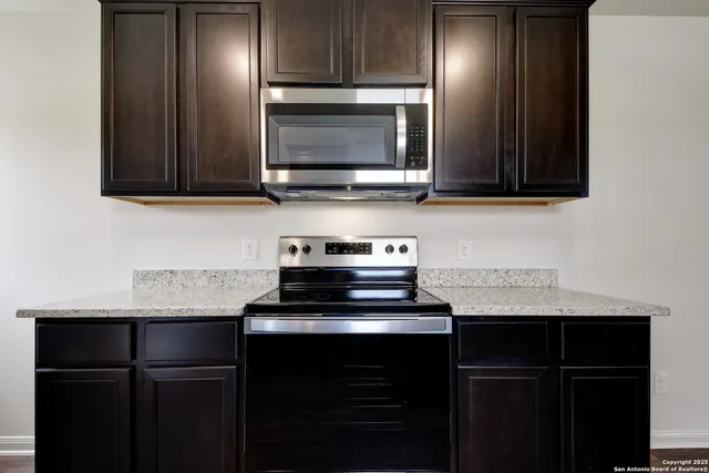 a kitchen with a sink and a microwave