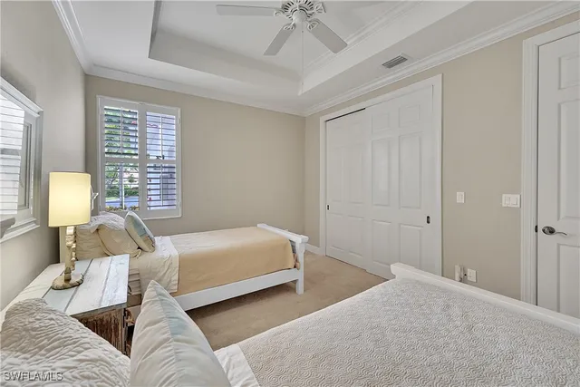 a bedroom with bed and window