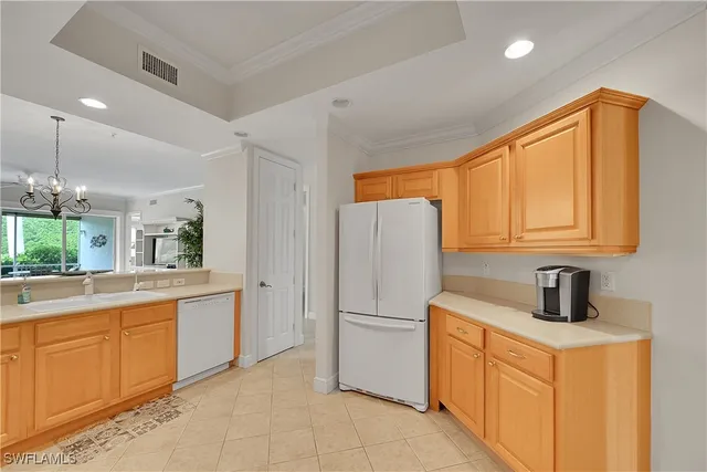 a kitchen with a refrigerator and a sink