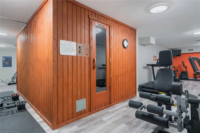 a living room with furniture a rug and a window