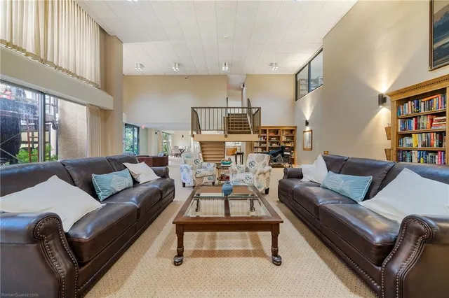 a living room with furniture and a window