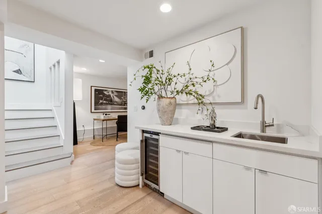 a kitchen with a sink and cabinets