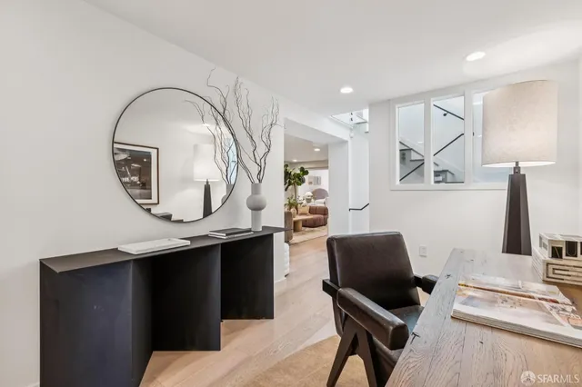 a work room with furniture and a mirror