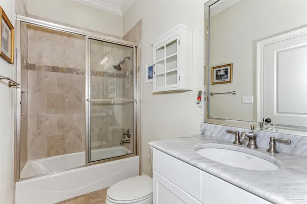 a kitchen with stainless steel appliances granite countertop a sink and a wooden floors