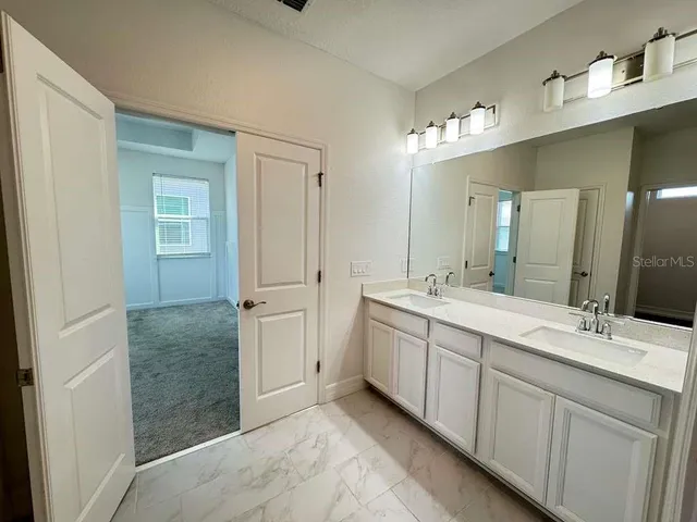 a view of an empty room and wooden floor