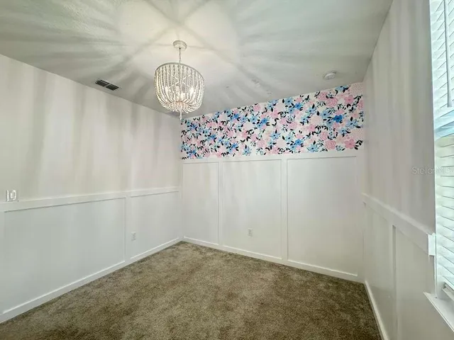 a bathroom with a shower sink vanity and mirror