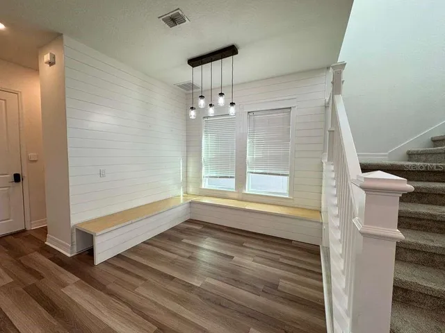a open kitchen with white cabinets and a dishwasher