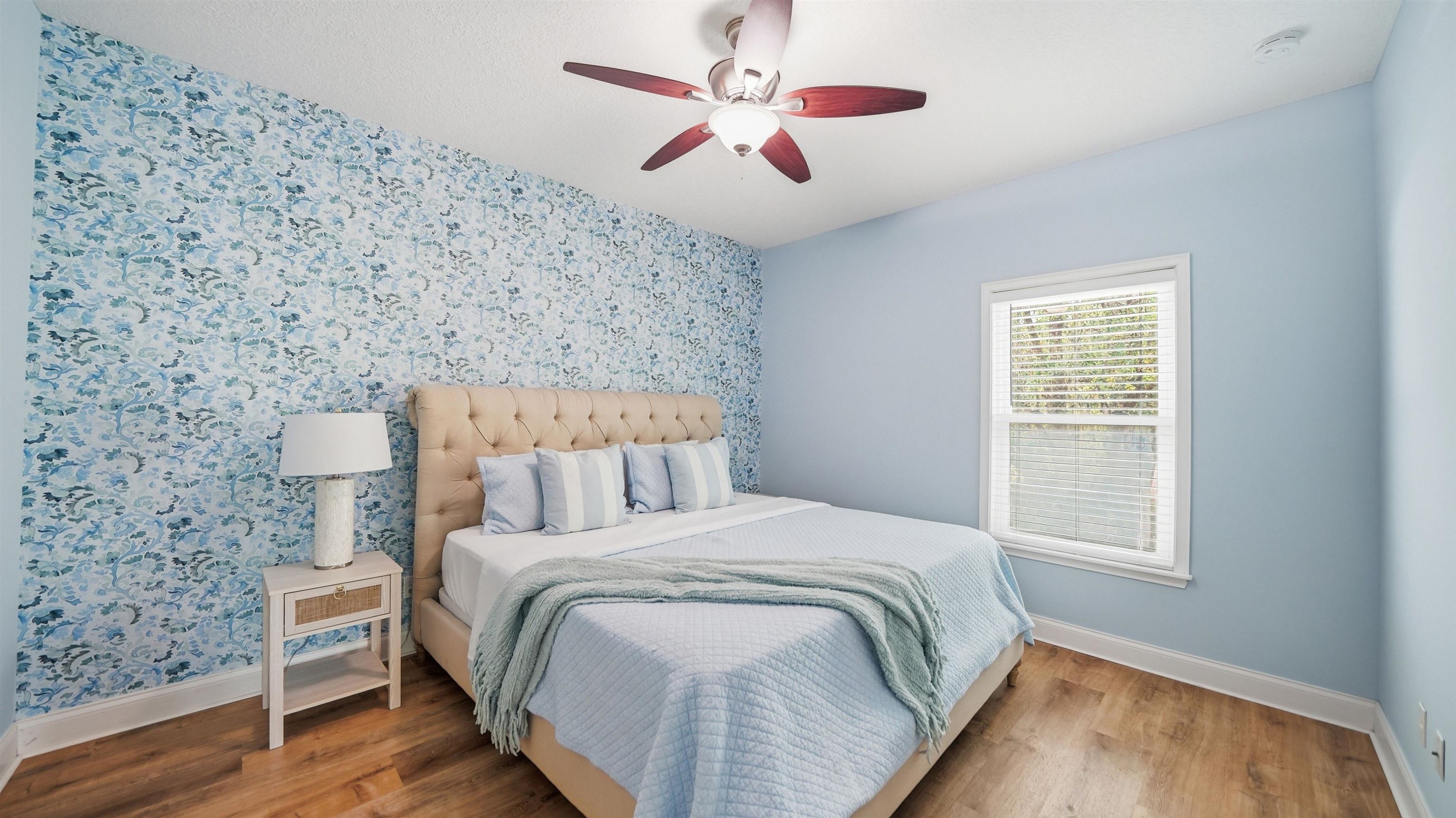 251 Riberia Street St. Augustine, FL 32084 - Photo 16 of 94 a bedroom with a bed and a chandelier