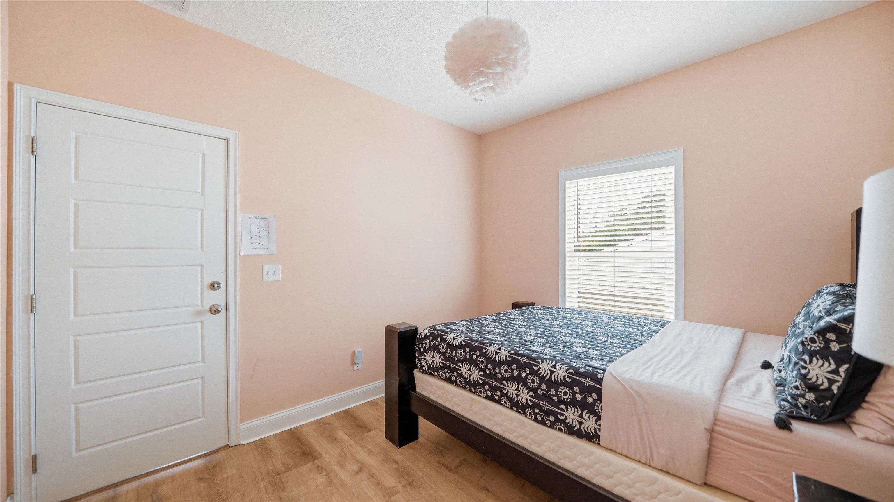 251 Riberia Street St. Augustine, FL 32084 - Photo 26 of 94 a bedroom with a bed and a window