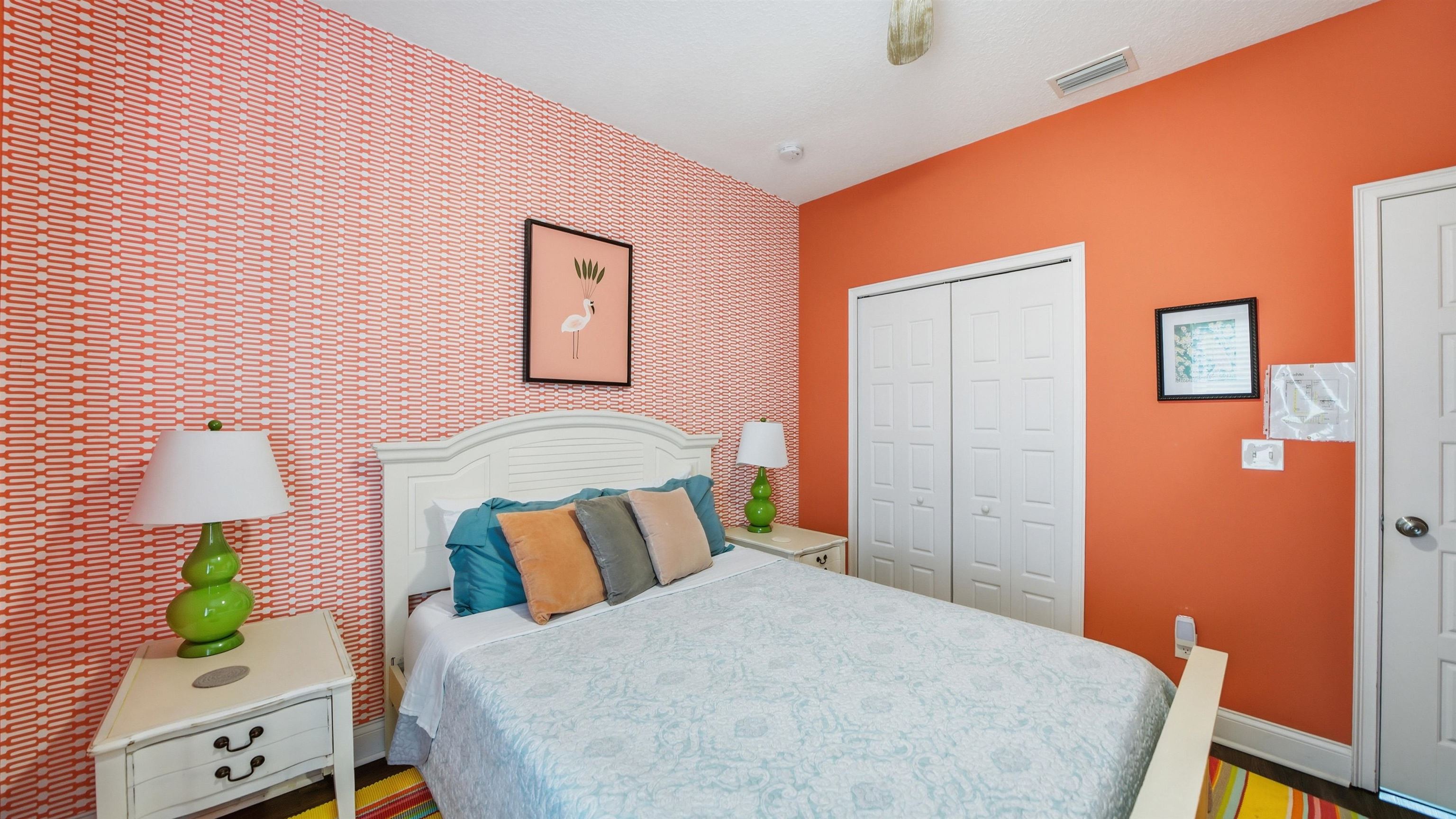 251 Riberia Street St. Augustine, FL 32084 - Photo 48 of 94 a bedroom with a bed and a lamp on table