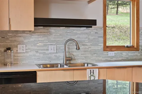 a close view of sink and mirror