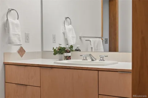 a bathroom with a sink and a mirror