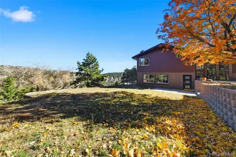 a view of house with yard