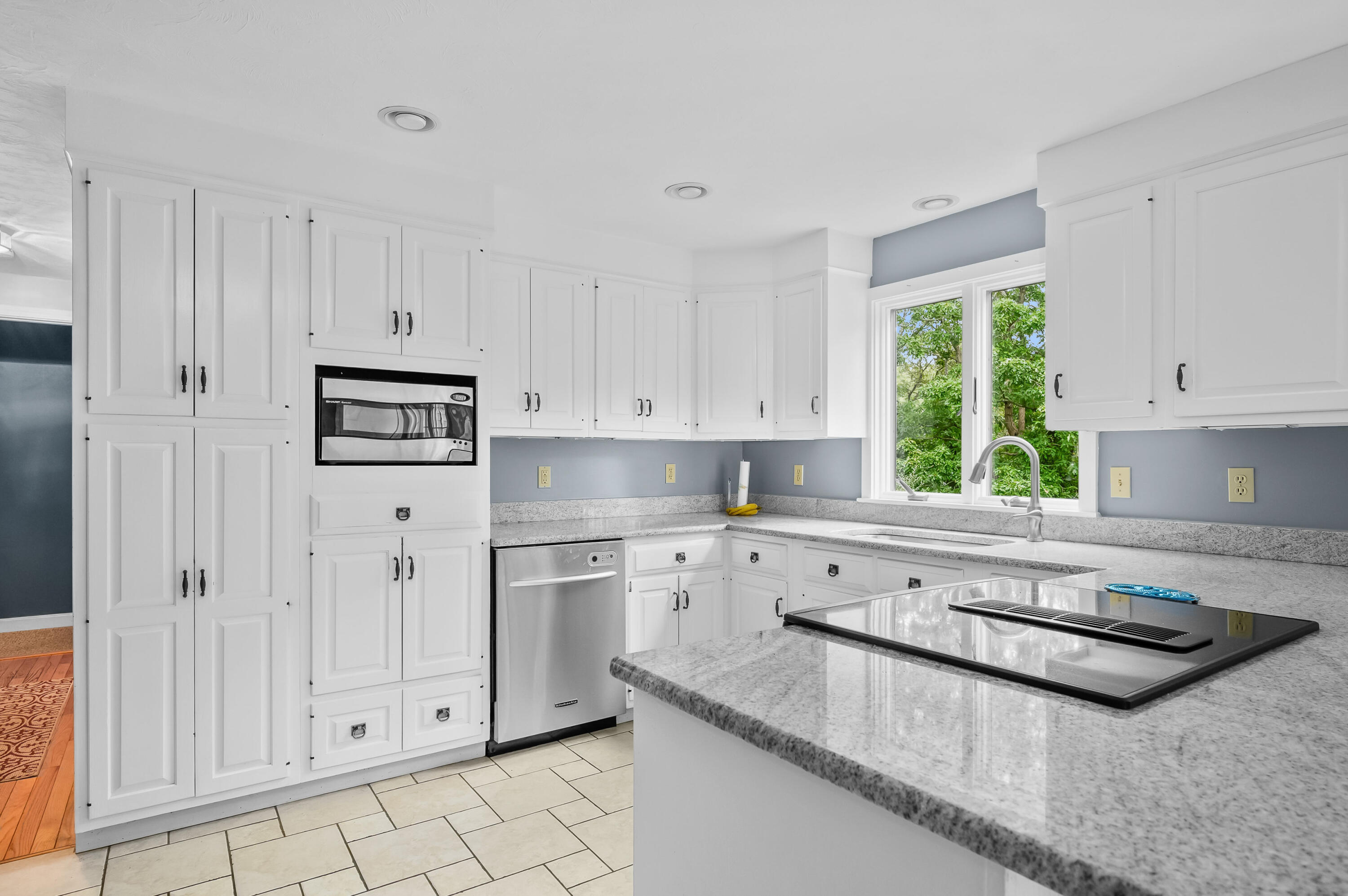 42 Marble Road Barnstable, MA 02630 - Photo 16 of 37 a large white kitchen with granite countertop white cabinets and a sink