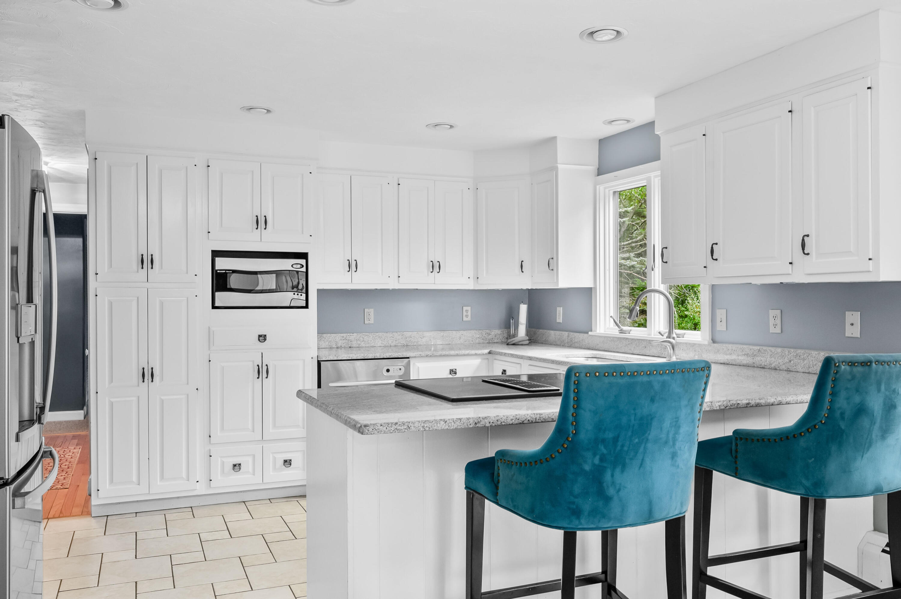 42 Marble Road Barnstable, MA 02630 - Photo 17 of 37 a kitchen with stainless steel appliances granite countertop a stove a refrigerator and white cabinets