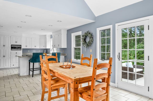 a dining room with a table and chairs