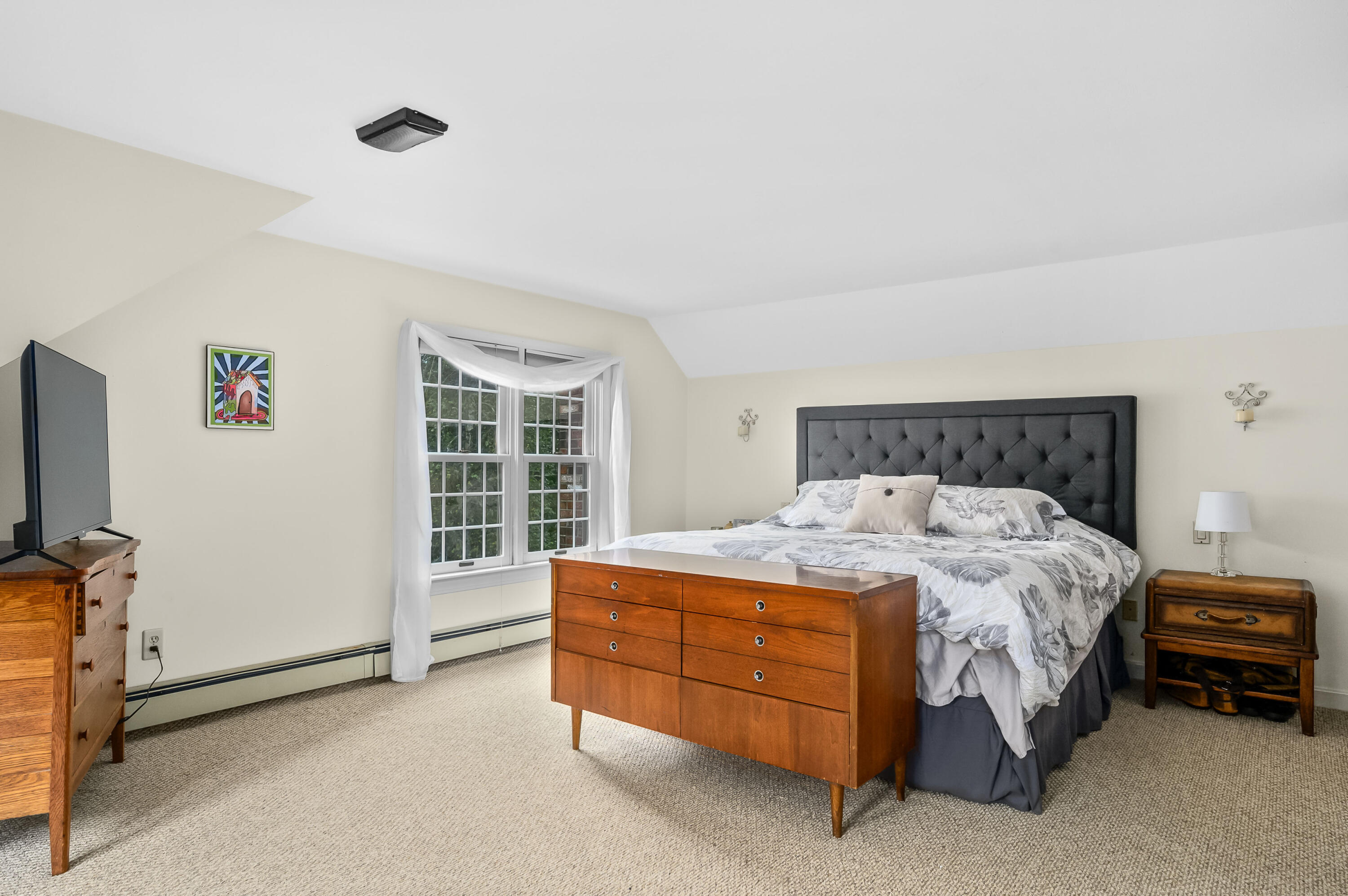 42 Marble Road Barnstable, MA 02630 - Photo 26 of 37 a bed sitting in a room next to a window