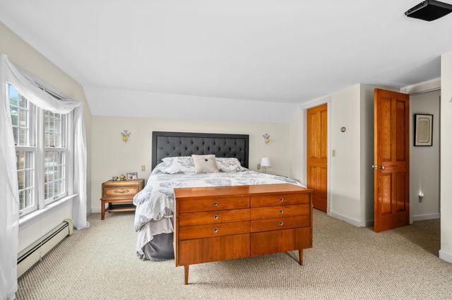 a room with a bed and a cabinets