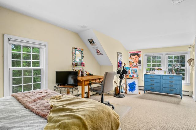 a bed room with a bed and a window