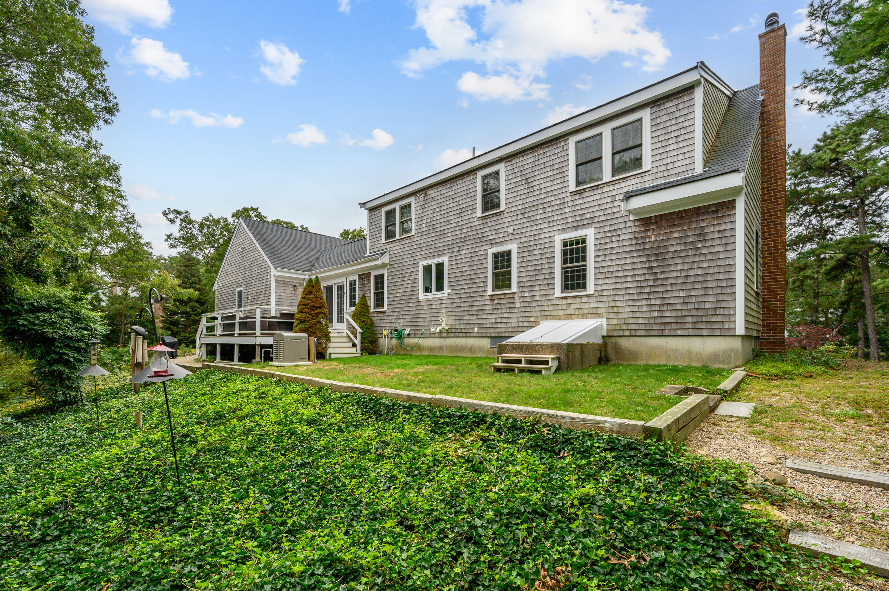 42 Marble Road Barnstable, MA 02630 - Photo 5 of 37 a front view of a house with a yard and porch