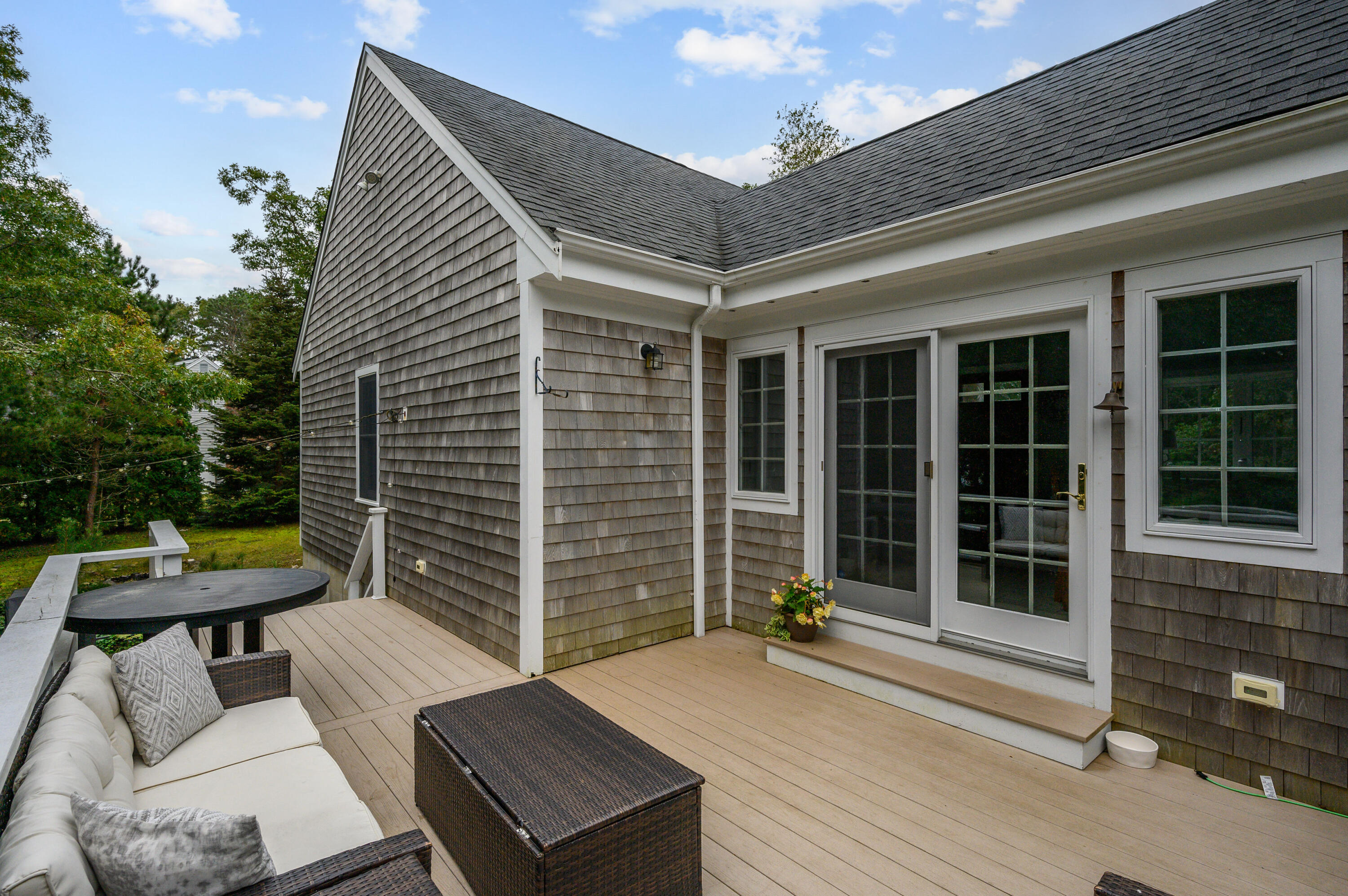 42 Marble Road Barnstable, MA 02630 - Photo 8 of 37 a view of a patio with a table and chairs