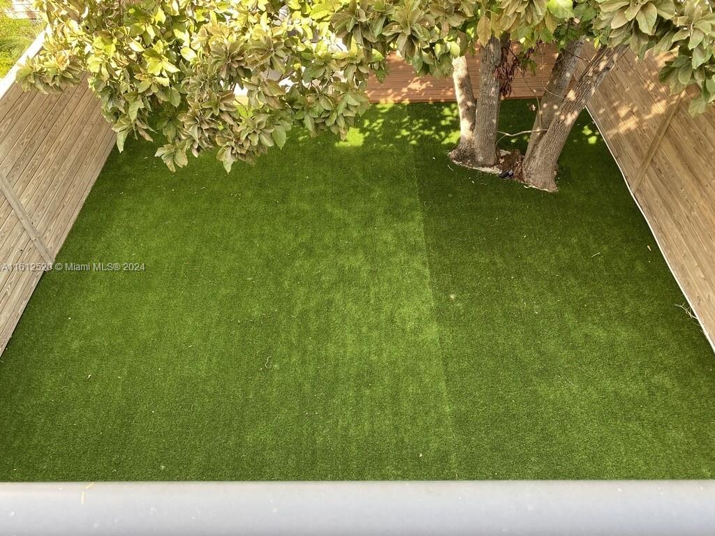 3445 Southwest 14th Street, Unit 3445 Miami, FL 33145 - Photo 21 of 52 a backyard of a house with lots of green space